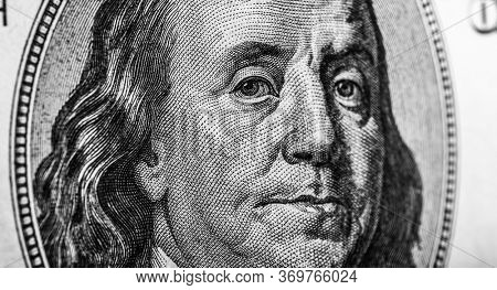 Benjamin Franklin's head on one hundred dollar banknote