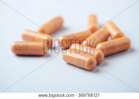 Hmb (β-hydroxy β-methylbutyric Acid) Capsules. Bodybuilding Food Supplements On Bright Paper Backgro