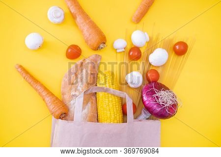 Grocery Food D.elivery At Home Flat Lay On Yellow Background. Paper Craft Bag With Grocery And Vario