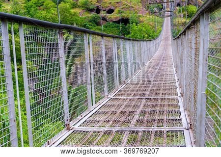 Metal Mesh Suspension Bridge Over The Gorge - A Landmark Of Armenia In Khndzoresk