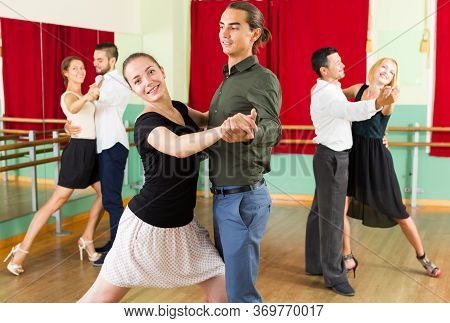 Adults People Having Expressive Dancing Class In Studio