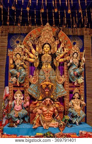 Goddess Durga Idol At Decorated Durga Puja Pandal, Shot At Colored Light, In Kolkata, West Bengal, I