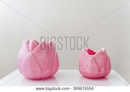 Two Pink Flower Shaped Candles With White Background. Zen And Minimalist Background With Pastel Tone