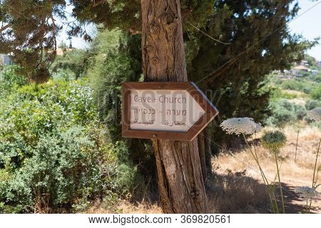 A Sign With Inscriptions In English, Hebrew And Arabic Indicating The Direction To The Monastery Of 