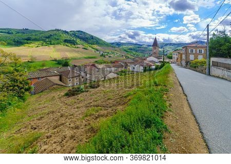 Landscape Of Vineyards And Countryside In Beaujolais, With The Village Vaux-en-beaujolais. Rhone Dep