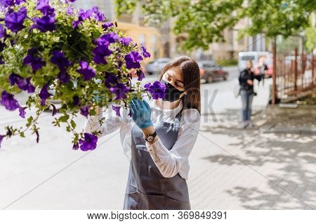 Close Up Portrait Of Italian Woman Owner Of Floral Shop In Mask On Quarantine Easing, Lockdown End A