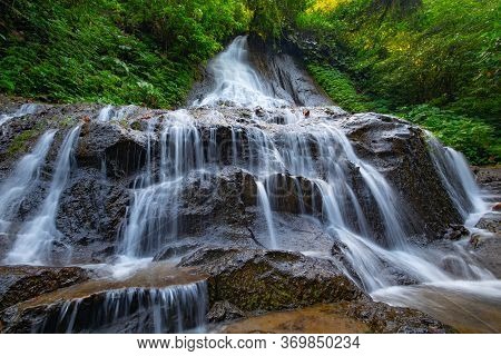 Waterfall Landscape. Beautiful Hidden Goa Giri Campuhan Waterfall In Tropical Rainforest. Adventure 