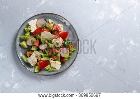 Fattoush Vegetarian Salad In A Gray Plate On A Gray Background. Copy Space. Top View. Levantine Fatt