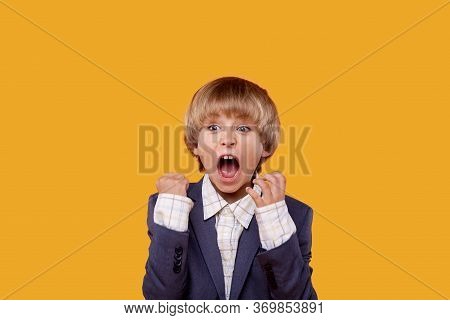 The Boy In The Gray Jacket Rejoices In Victory. Hands Up.