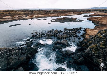 Mountain River From Ehsaraurfoss Falls, In Silfra Fault, Tingwedlir Valley.