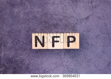 Word Acronym Nfp As Not For Profit Is Made Of Wooden Building Blocks. Concept.