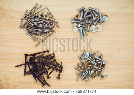 Screws And Nails On The Wood Bachground. Mock Up.