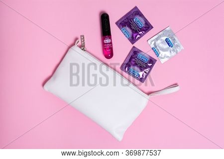 Kyiv, Ukraine - 21 May 2020: Durex Condoms Elite, Invisible And Durex Intense Orgasmic Gel Near A Wh