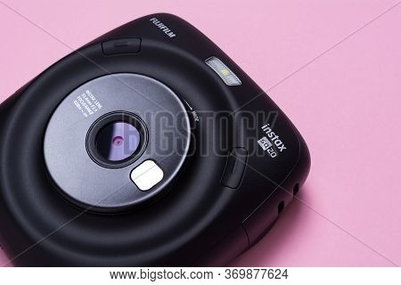 Kyiv, Ukraine - 25 May 2020: Fujifilm Instax Sq 20 Black On Apink Background