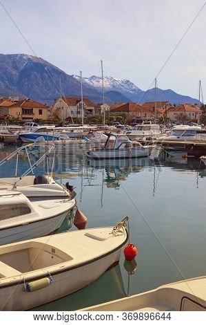 Fishing Boats In Harbor. Montenegro, Bay Of Kotor. View Of Marina Kalimanj In Tivat City Against Sno