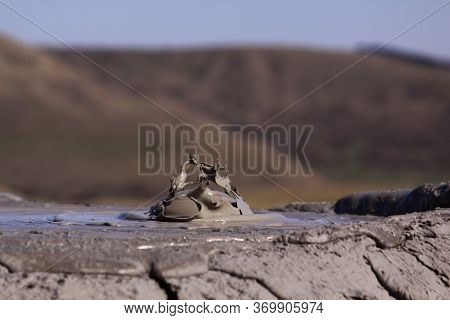 Paclele Mari Mud Volcano In Buzau, Romania. The Berca Mud Volcanoes Is A Geological And Botanical Re