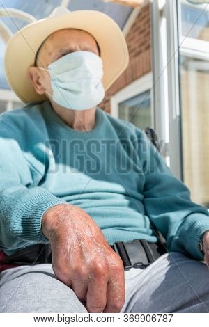 Elderly Man Wearing Face Mask As Coronavirus Protection,hampshire,united Kingdom.