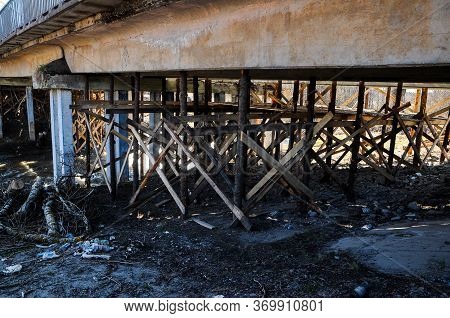 Wooden Beams Under The Bridge, Engineering Structures To Support The Old Bridge, In The Form Of Cros