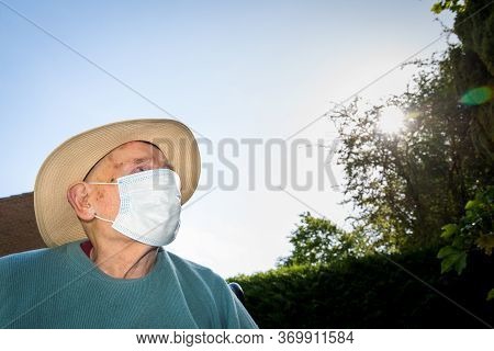 Elderly Man Wearing Face Mask As Coronavirus Protection,hampshire,united Kingdom.