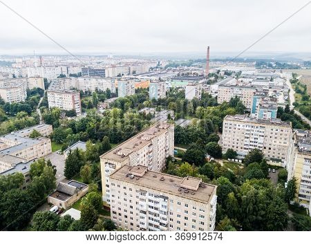 Aerial View Of Town With Socialist Soviet Panel Building At Cloudy Day. Buildings Were Built In The 