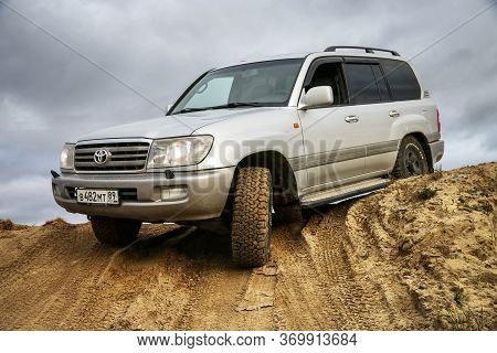 Novyy Urengoy, Russia - June 3, 2020: Offroad Car Toyota Land Cruiser 100 At The Countryside.