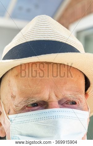 Elderly Man Wearing Face Mask As Coronavirus Protection,hampshire,united Kingdom.
