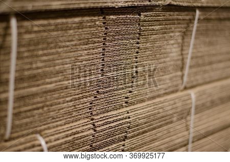 Disassembled Cardboard Boxes. Stacked Cardboard Blanks. Cardboard Production.
