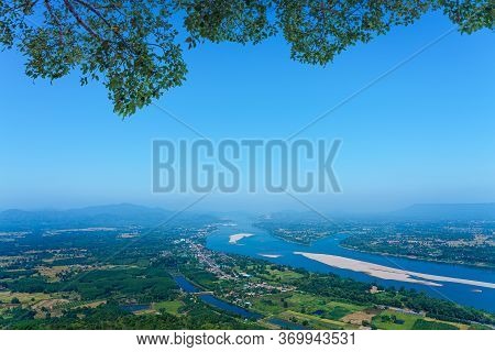 View From The Pha Tak Suea Temple. Landscape Below Is The Mekong River Which Separates The Border Be
