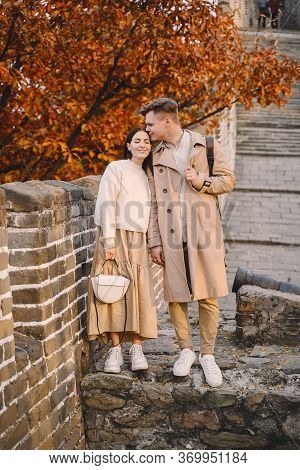 Young Couple Kissing At The Great Wall Of China