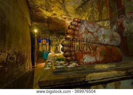 Dambulla, Sri Lanka - February 08, 2020: View Of Ancient Giant Sculpture Of Reclining Buddha From Th
