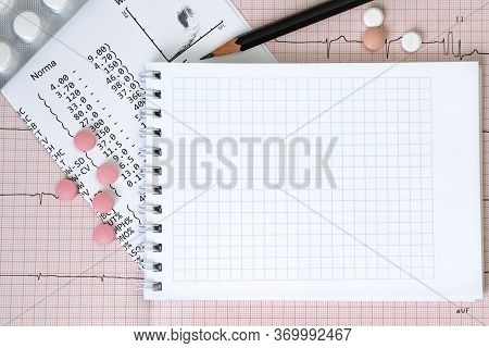 Empty Notebook Page On A Table With A Pills And Pencil, Medical Concept, Top View