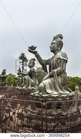 Buddhist Deva Statues Offering Gifts To The Tian Tan Big Buddha  Statue On Lantau Island, Hong Kong