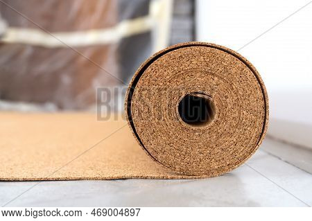 Roll Of Wood Cork On The Floor In A Room Before Laying The Flooring. Cork - A Natural Material. Cons