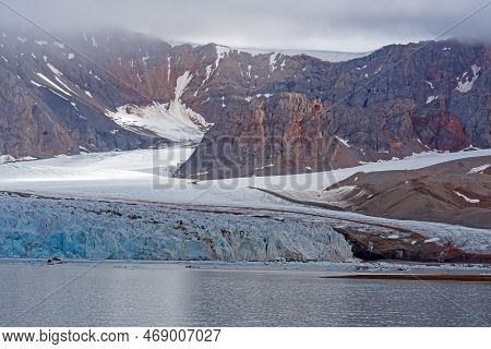 Ice And Rocks In The High Arctic At The Fourteenth Of July Glacier In The Svalbard Islands