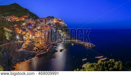 Traditional Colorful Houses Above The Mediterranean Sea In The Romantic Old Town Of Manarola In Cinq