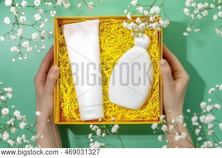Female Hands Hold Yellow Gift Box With Beauty Product Set. Preparing Self Care Package, Craft Gift B