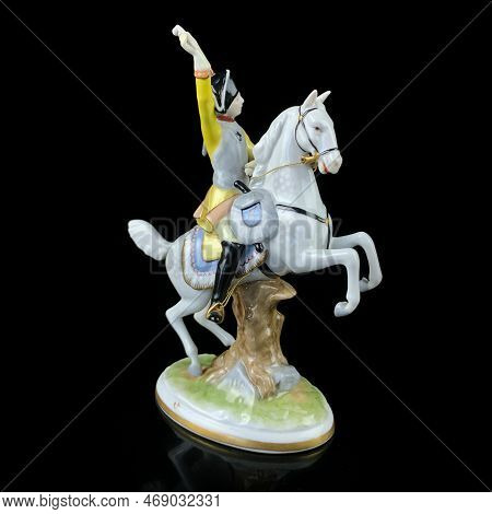 Figurine Of An Elephant On A Black Background With Reflection. Antique Porcelain Figurine Of An Elep