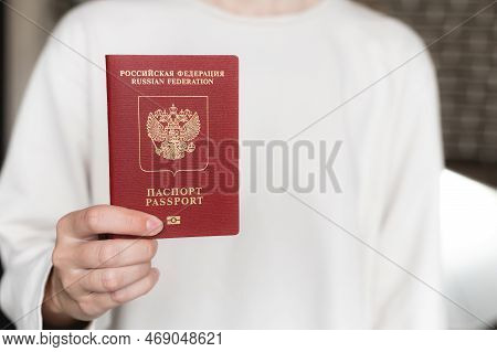 Foreign Passport Of The Russian Federation. Human Female Hand With A Russian Passport Close-up On Th