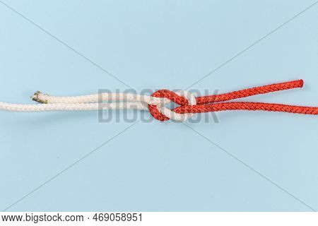 Rope Granny Knot, Also Known As False Knot On A Blue Background