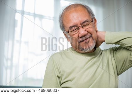 Old Man Suffering From Nape Neck Pain At Home, Elderly Acute Neckaches, Sad Senior Man Neckache Hand