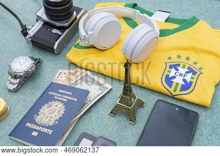 11 Jan 2023: Bauru, Brazil: Antique Camera, Silver Wristwatch, Brazilian Soccer Team T-shirt, Headph