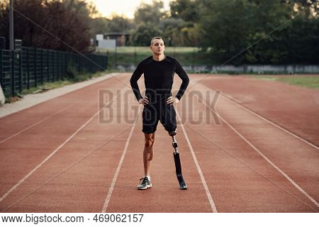 A Sportsman With Artificial Leg Preparing To Workout At Stadium.