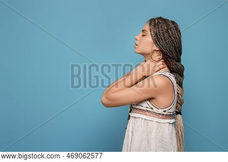 Beautiful Woman With Long African Braids On Blue Background, Space For Text