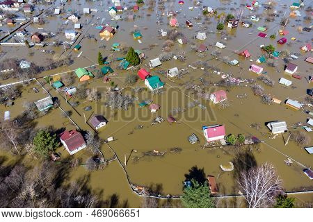 Aerial View Of The Flooded Suburban Areas During The Spring Flood. Houses In The Water During The Fl