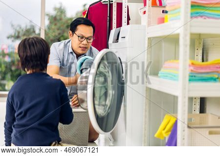 Family Asian Father And Kid Little Boy Son Having Fun Doing Household Chores Doing Laundry Dirty Clo