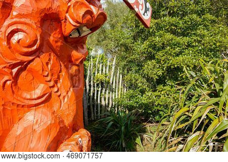 Bay Of Plenty New Zealand - July 23 2010; Close Up Maori Totem Pole Or Pouwhenua Painted Red Against