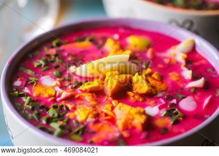 Cold Beetroot Soup With Boiled Eggs And Greenery. Traditional Summer Food.