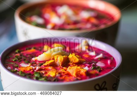 Cold Beetroot Soup With Boiled Eggs And Greenery. Traditional Summer Food.