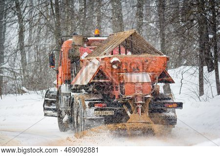 A Gritter Truck Spreads Sand On A City Road In Winter: Russia - February 2021