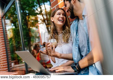 Happy Couple In Love Using Digital Devises For Work, Study Or Social Media.
